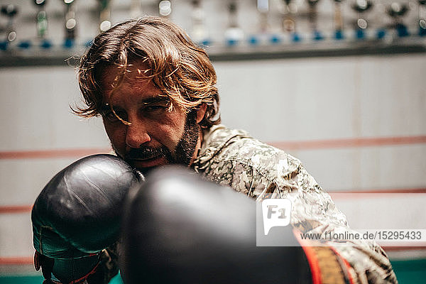 Boxer training in boxing ring