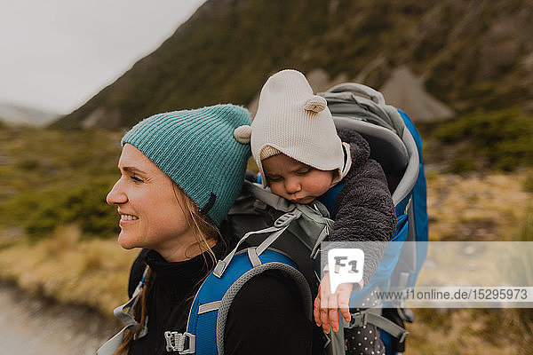 Hiker and baby exploring trail  Wanaka  Taranaki  New Zealand