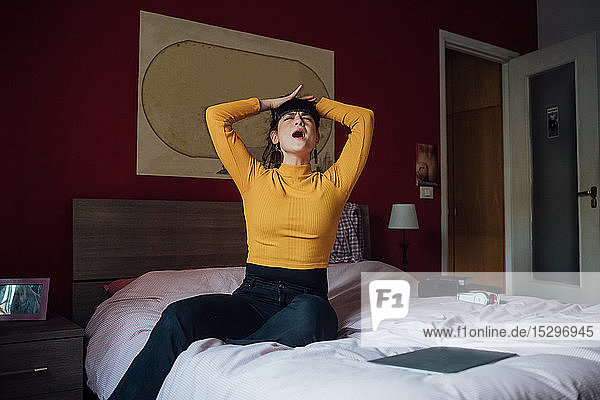 Stressed woman on bed
