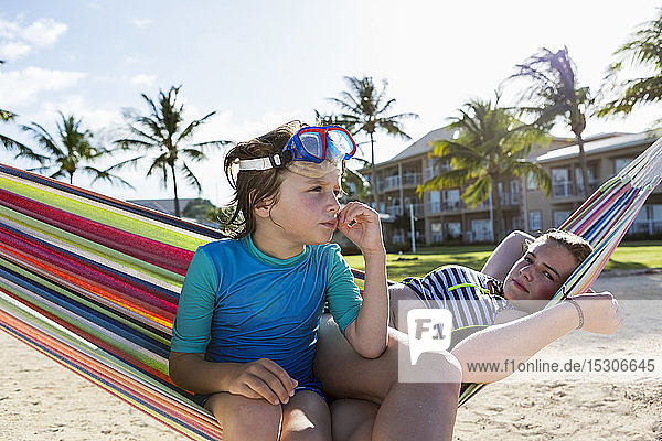 5 year old boy in hammock with his 13 year old sister