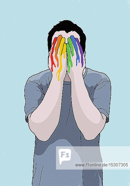 Mann bedeckt Gesicht mit regenbogenfarbenen Händen