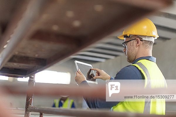 Architect using laptop at construction site