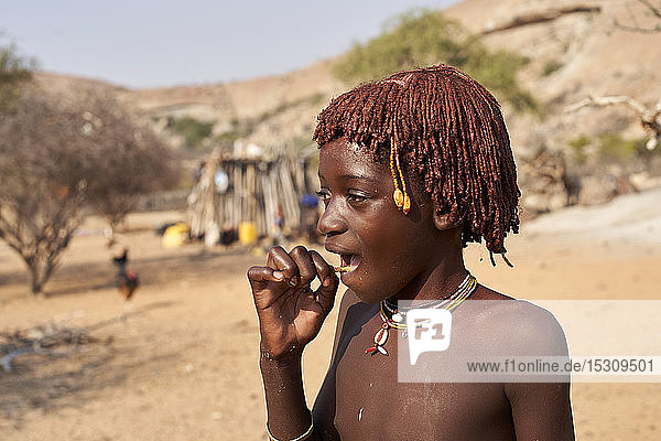 Young mucubal girl in her traditional hairstyle  Tchitundo Hulo  Virei  Angola