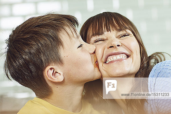 Son kissing his mother  portrait