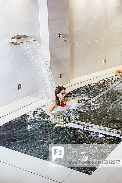 Woman enjoying the whirlpool in a spa