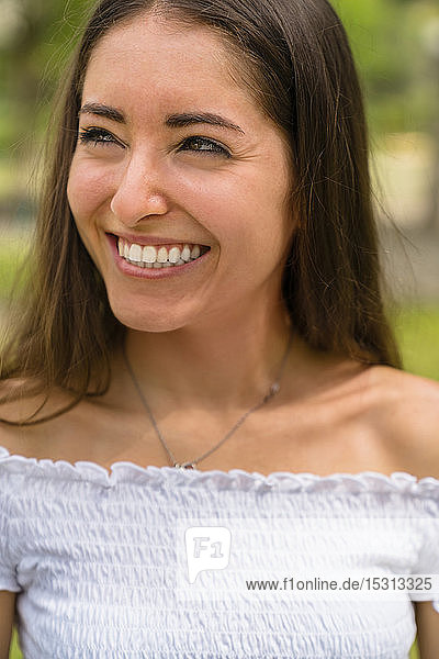 Portrait of young woman in park