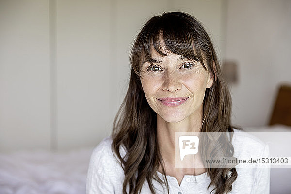 Portrait of smiling woman at home
