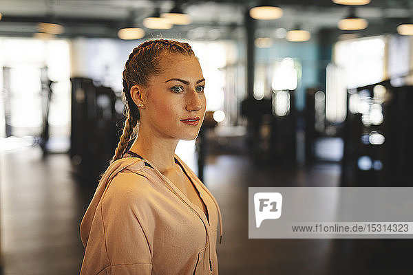 Portrait of young woman in a gym