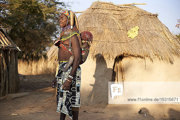 Muhila tribe woman carrying her child on her back  Kehamba  Chibia  Angola