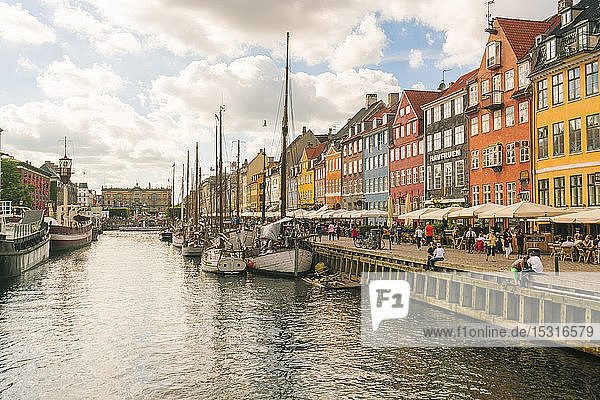 Nyhavn with old colourful houses and historic boats anchored at Nyhavn  Copenhagen  Denmark