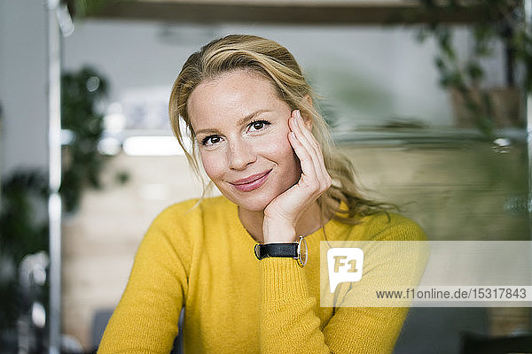 Portrait of a blond woman  sitting in a coffee shop
