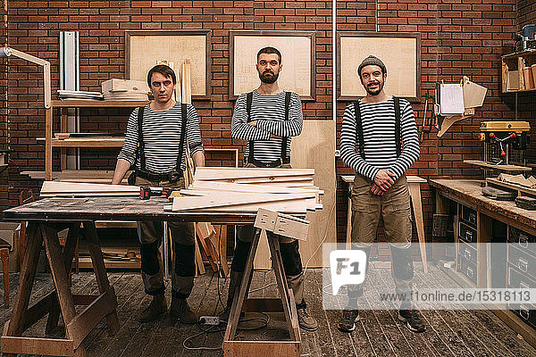 Team of carpenters in the workshop