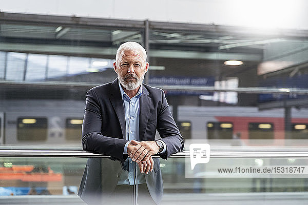 Portrait of mature businessman at the station platform