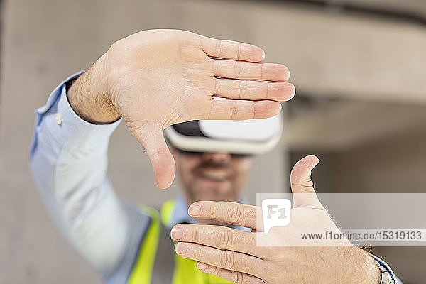 Architect with VR glasses at construction site