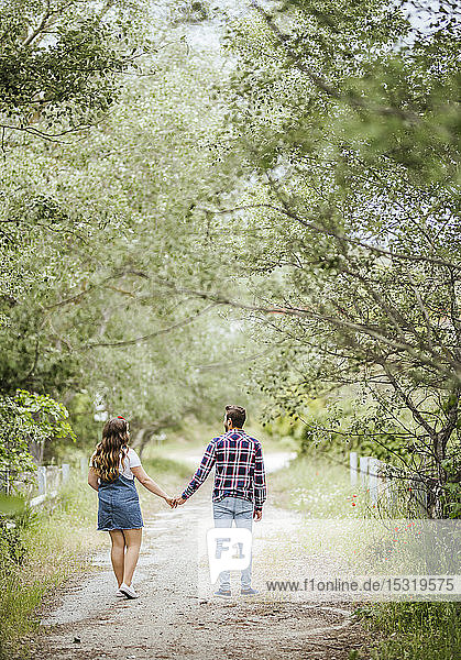 Young couple going for a walk holding hands