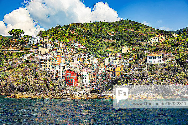 Riomaggiore Cinque Terre Liguria Italy - 09 August 2018 - view of the colorful houses and the harbor from the sea
