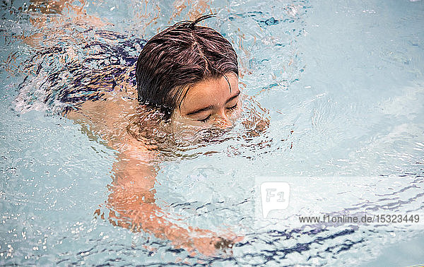 Little boy in a swimming pool  head under the water
