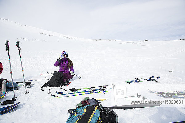 Woman resting from cross country skiing