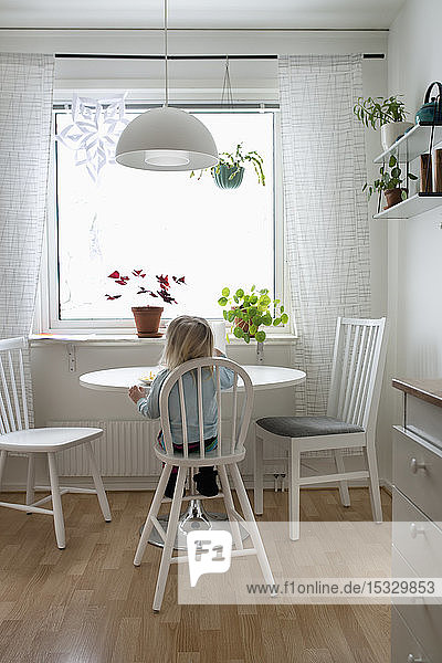 Girl sitting at a table