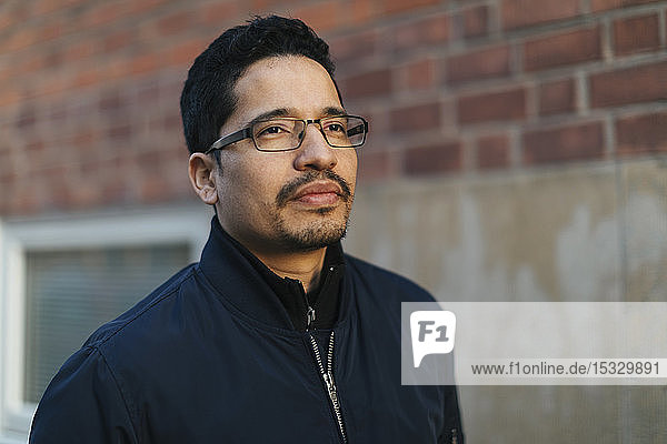 Portrait of mid adult man wearing glasses