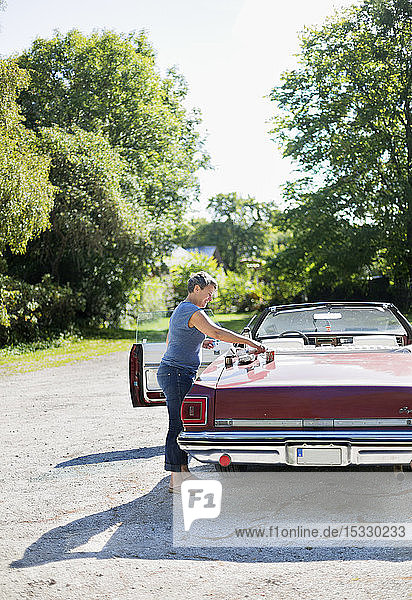 Mature woman taking break during road trip