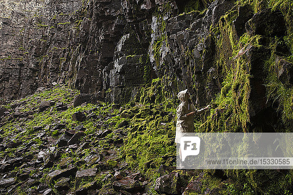 Woman by cliff in Fulufjallet National Park Sweden