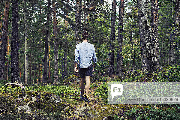Man walking in forest