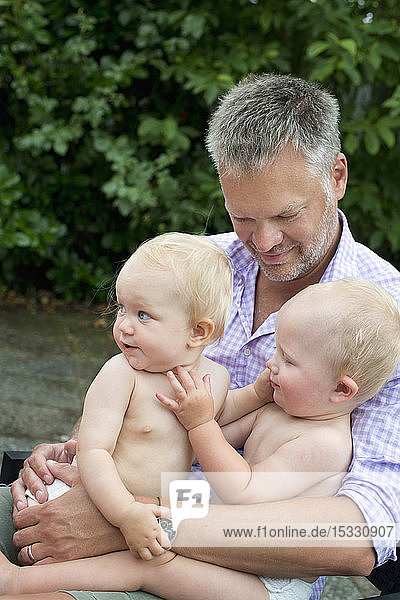 Man holding his children