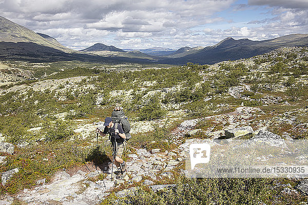 Man hiking in Rondane National Park Norway