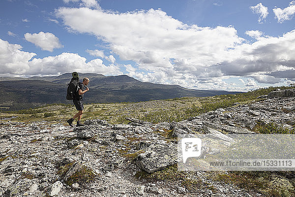 Man hiking in Rondane National Park Norway