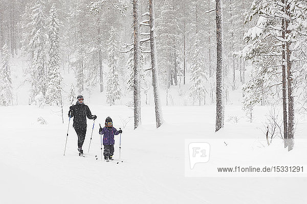 Mother and daughter skiing