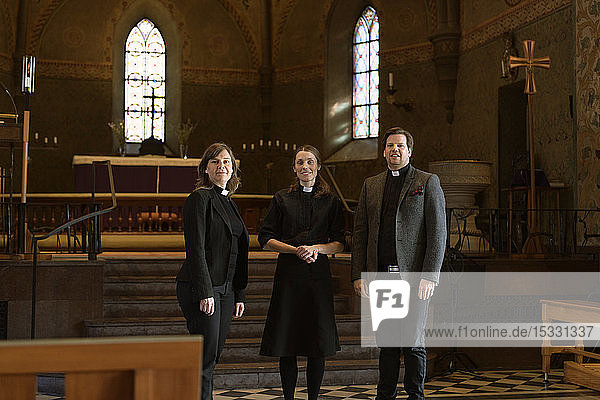 Portrait of priests in church