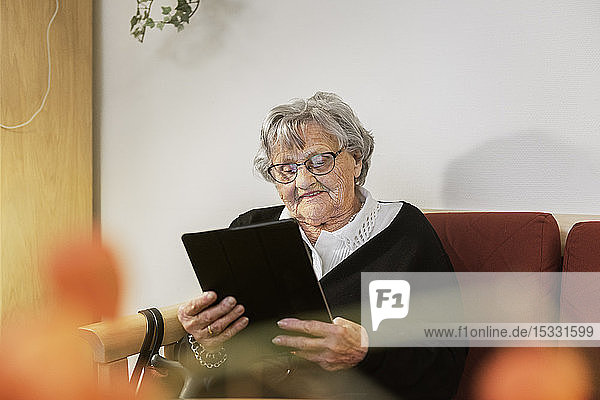 Senior woman using tablet PC