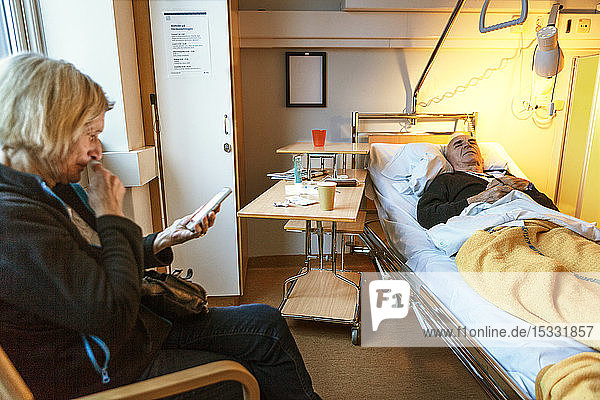 Wife visiting husband in hospital