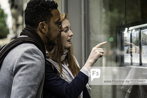 Couple looking at window display