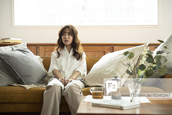 Young Japanese woman on the sofa