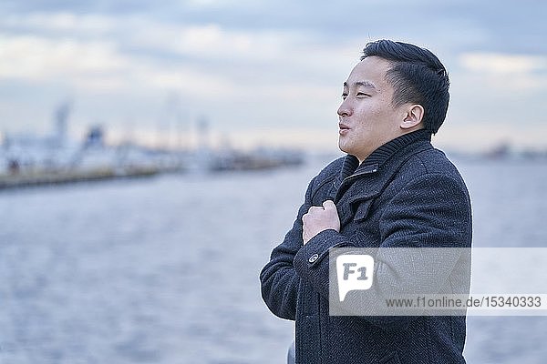 Young Japanese businessman outside
