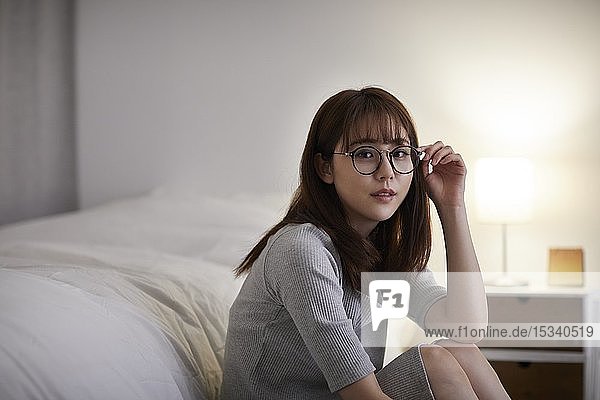 Young Japanese woman in the bedroom