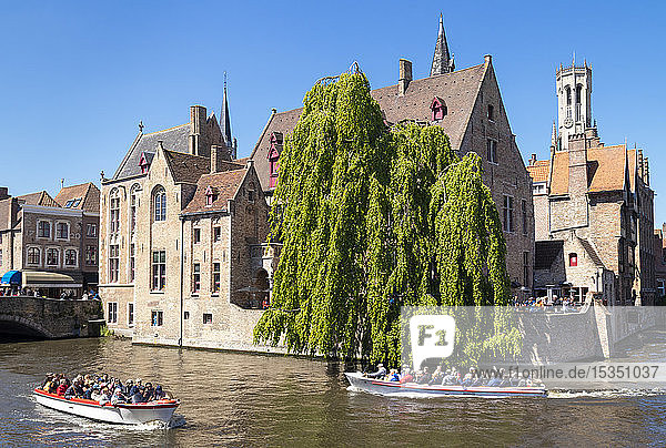 Bruges Belfry and tourist boats on Den Dijver Bruges Canal  Bruges  UNESCO World Heritage Site  West Flanders  Belgium  Europe