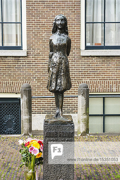 Statue of Anne Frank outside Westerkerk Church Amsterdam North Holland The Netherlands Europe