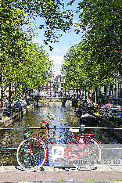 Bicycle on a bridge Leidsegracht canal Amsterdam North Holland The Netherlands Europe