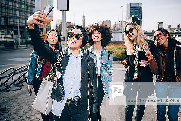 Friends taking selfie in street  Milan  Italy