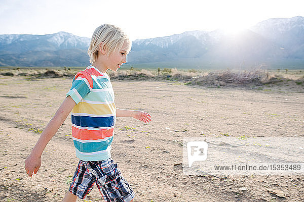 Boy exploring rural landscape  Olancha  California  US