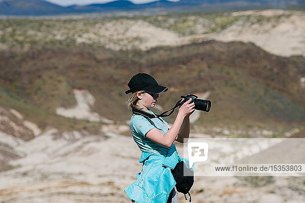 Girl taking photograph of view  Red Rock Canyon  Cantil  California  United States
