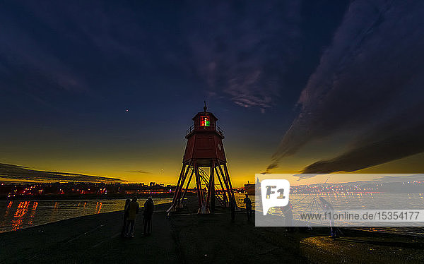 Herd Groyne Lighthouse and dramatic sunset; South Shields  Tyne and Wear  England