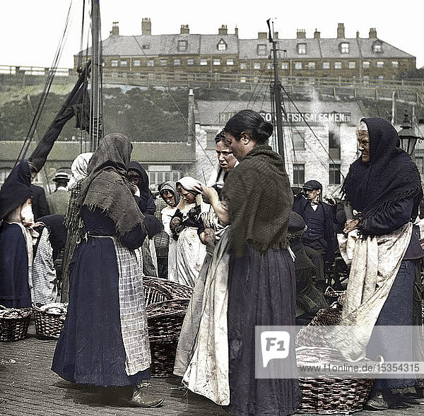 Magic Lantern Slide circa 1880  Victorian/Edwardian Social History. Fish women at North Shields Fish Quay with baskets of herring; North Shields  Tyne and Wear  England