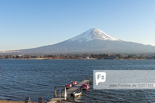 Footbridge with pedal boats  view over Lake Kawaguchi  back volcano Mt. Fuji  Yamanashi Prefecture  Japan  Asia