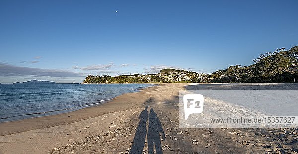 Shadow of two persons  couple on the beach  Langs Beach  Northland  North Island  New Zealand  Oceania