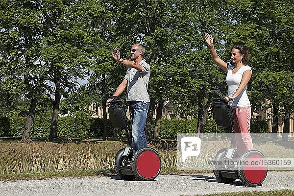 Man and woman riding Segways and having fun  Germany  Europe