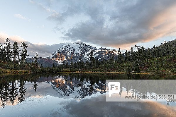Sunset  Mt. Shuksan glacier with snow reflected in Picture Lake  wooded mountain landscape  Mt. Baker-Snoqualmie National Forest  Washington  USA  North America
